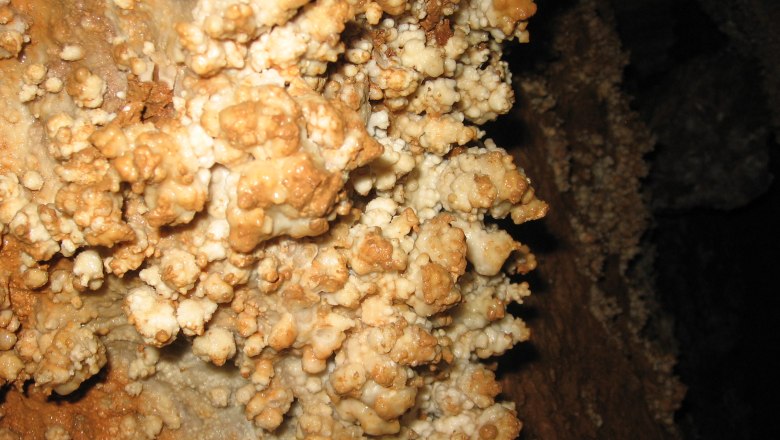 Close-up of mineral deposits in a cave.